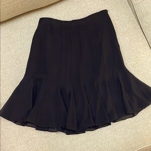 Black sheer Tahari Skirt with Lining. No size but definitely very small.